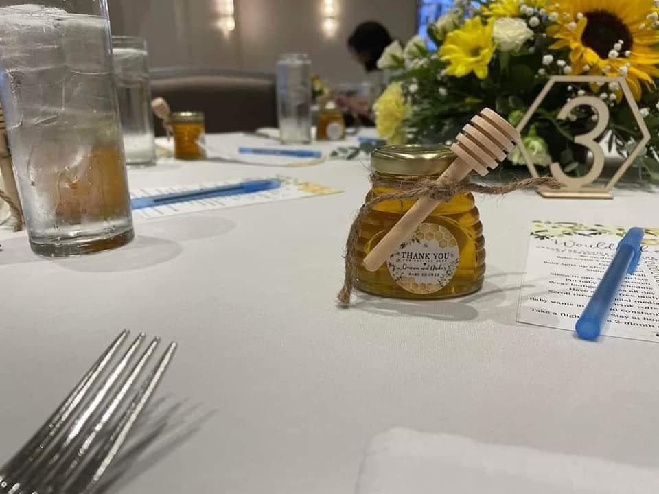Honey favors arranged on a display table